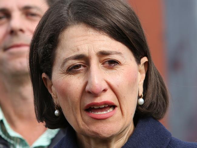 NEWCASTLE, AUSTRALIA - NewsWire Photos - May 22, 2021. Premier Gladys Berejiklian ..... Nationals candidate Dave Layzell votes in the Upper Hunter by-election at Muswellbrook Sports Centre with the support of Premier Gladys Berejiklian and Deputy John Barilaro.  Picture: NCA NewsWire / Peter Lorimer.