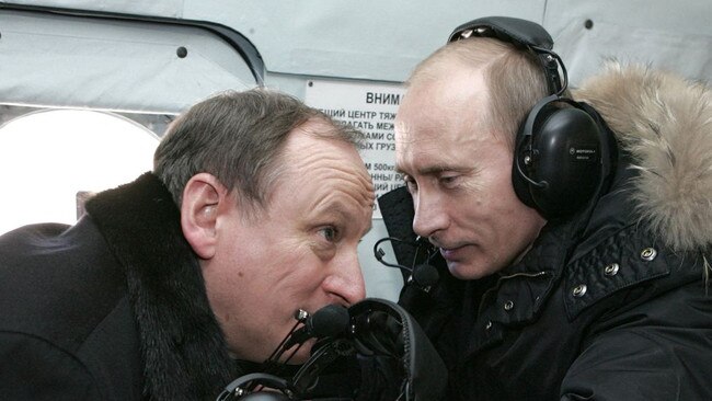 Patrushev and Putin on a helicopter to visit a military outpost in Nalchik, Russia, near Chechnya, in 2008. Picture: AFP/Getty Images