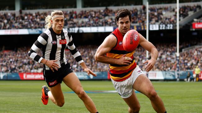 Darcy Fogarty and Darcy Moore chase a loose ball. Picture: Michael Willson/AFL Photos via Getty Images