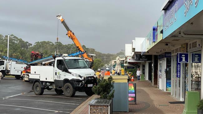 Energex crews arrived early Thursday morning to remove the power poles from Rainbow Beach Road. Picture: supplied