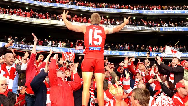 Kieren Jack celebrates Sydney’s grand final victory in 2012 with fans.