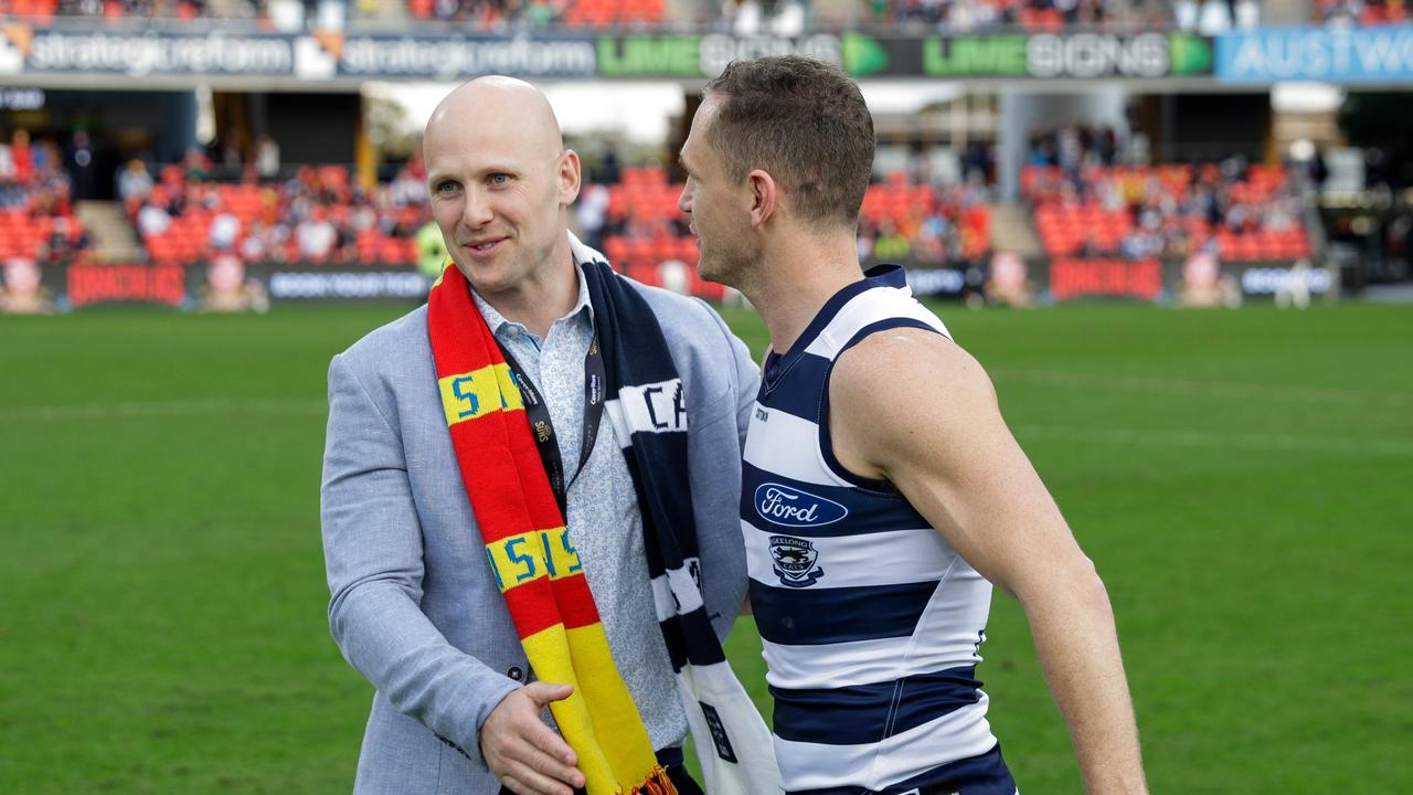 GOLD COAST, AUSTRALIA - AUGUST 13: Gary Ablett Jr. and Joel Selwood of the Cats embrace before the 2022 AFL Round 22 match between the Gold Coast Suns and the Geelong Cats at Metricon Stadium on August 13, 2022 in the Gold Coast, Australia. (Photo by Russell Freeman/AFL Photos via Getty Images)