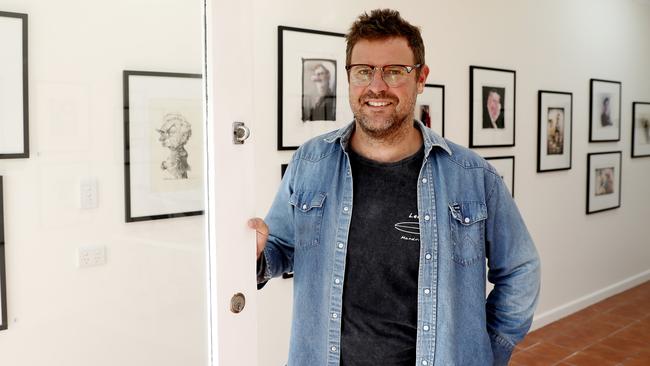 Cartoonist Johannes Leak at his gallery in Ettalong Beach. Picture: Nikki Short