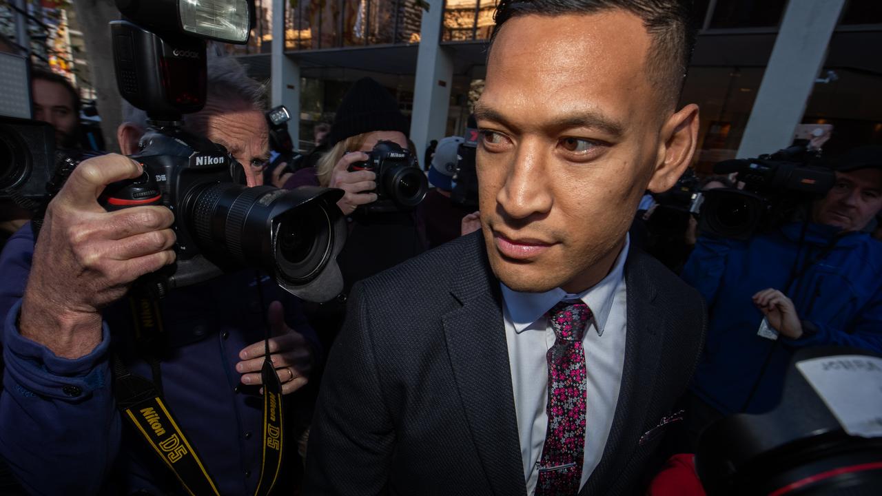 Israel Folau departs his conciliation meeting with Rugby Australia in Sydney.