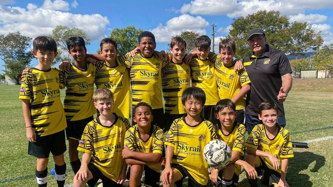 Pictured (l-r): Back row - Claude Yamine (Coach), Sam Weber, Marcellus Calcagno, Viyaan Jindal, Salvatore Brunetto (Captain), Kayem Kuman Front row- Hugo Stroud, Ace Moloney, Aizak Bridge, Dela (Jackson) Smith, Kaigo Koike, Lachlan Maher, Harry Bowen. Edge Hill United Under-12 celebrate winning the Filippo Mele 40th Year Memorial Carnival.