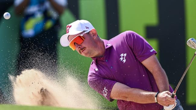 ADELAIDE, AUSTRALIA - FEBRUARY 14: Lucas Herbert of Ripper GC hits out of a bunker   on the 12th during day one of LIV Golf Adelaide at The Grange Golf Club on February 14, 2025 in Adelaide, Australia. (Photo by Mark Brake/Getty Images)