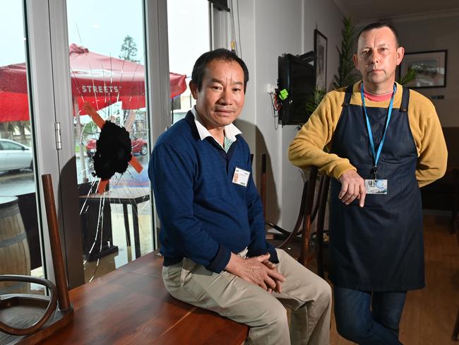 29/9/20. Over a dozen shop fronts were smashed overnight along Beach Road and the Esplanade at Christies Beach - Blu C Cafe owner Kam Ng Shung with Manager Nathan Orchard.Picture: Keryn Stevens