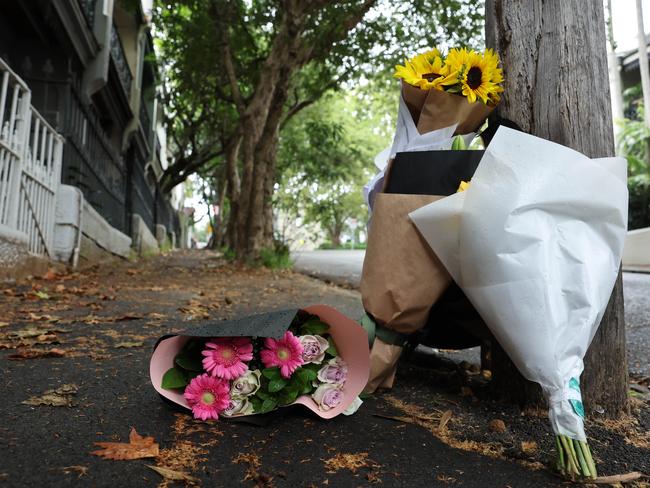 Flowers were left outside Baird’s Paddington home for the pair believe murdered. Picture: Tim Hunter