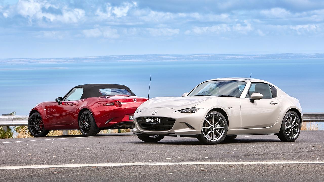 The Mazda MX-5 is available as a roadster (left) or retractable fastback (right).