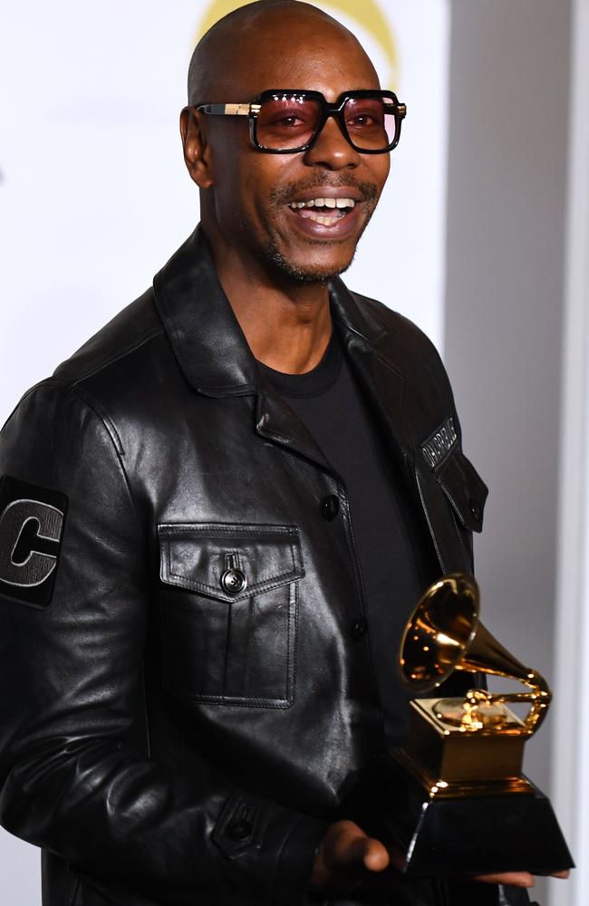 Comedian Dave Dave Chappelle poses in the press room with his trophy for Best Comedy Album during the 60th Annual Grammy Awards. Picture: AFP