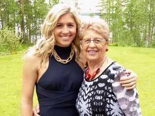 Holly Butcher (left) pictured at her brother Dean's wedding at a lakeside cottage in Finland on June 13, 2015.