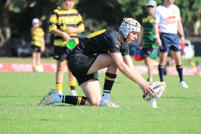 Finn Mackay lines up a shot at goal during the 2024 AIC rugby season.
