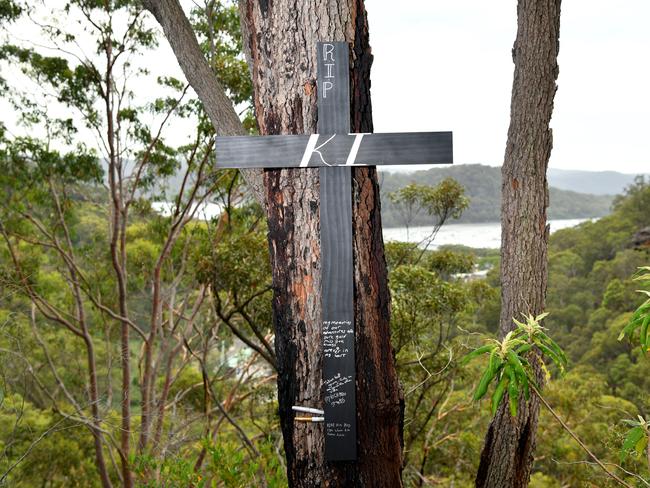 A tribute at the scene where a motorcyclist was killed on Saturday after coming off his bike on the Old Pacific Highway at Cowan, Sydney, Tuesday, Jan. 23, 2018. (AAP Image/Joel Carrett)