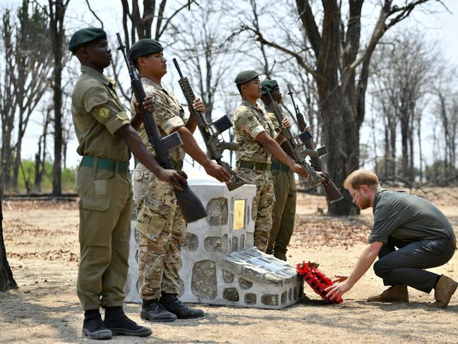 Britain's Prince Harry lays a wreath at the memorial site for Guardsman Mathew Talbot of the Coldstream Guards at the Liwonde National Park in Malawi. Picture: Dominic Lipinski/Pool via AP