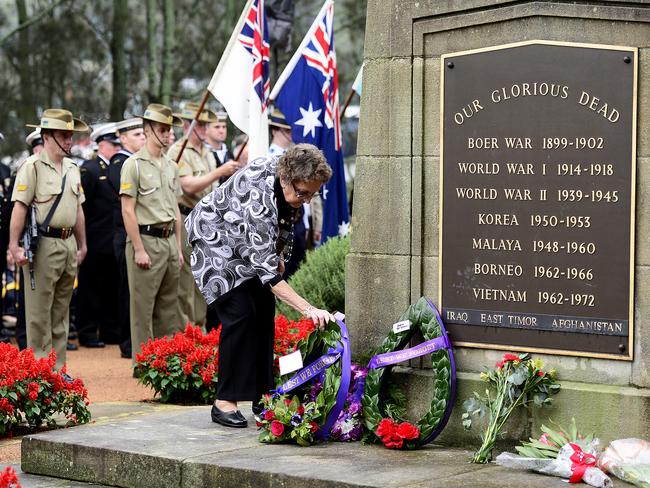 Wreath layers at the Gosford RSL Sub-Branch 99th Commemorative Anzac Day Service, Gosford Cenotaph.