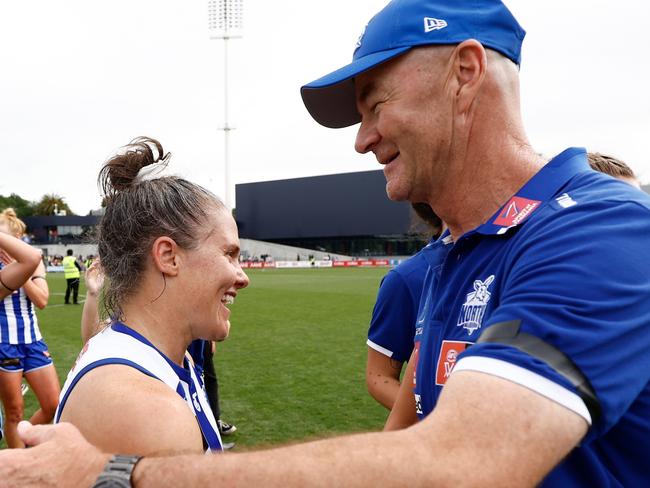 MELBOURNE, AUSTRALIA - NOVEMBER 26: Emma Kearney (left) and Darren Crocker, Senior Coach of the Kangaroos celebrate during the 2023 AFLW Second Preliminary Final match between The North Melbourne Tasmanian Kangaroos and The Adelaide Crows at IKON Park on November 26, 2023 in Melbourne, Australia. (Photo by Michael Willson/AFL Photos via Getty Images)