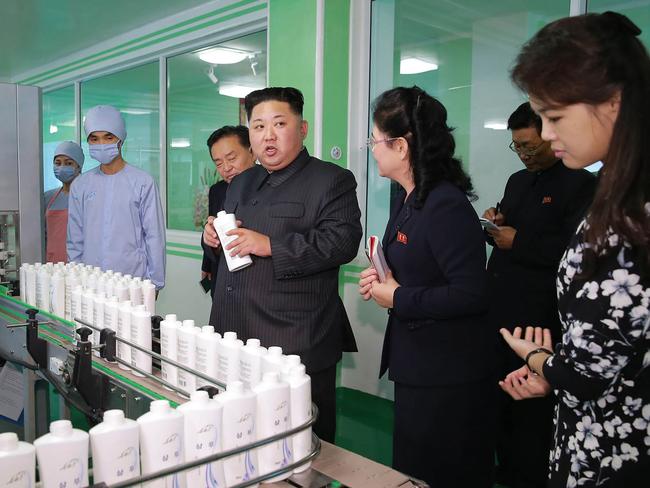 Maybe she’s born with it … maybe it’s Pyongyang Cosmetics Factory<span id="U631630873697oWE" style="font-family:'Courier New';">™</span>. That’s Kim Jong-un’s wife on the far right. Picture: AFP/KCNA via KNS