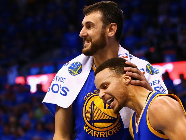 OKLAHOMA CITY, OK - MAY 28: Andrew Bogut #12 of the Golden State Warriors celebrates with Stephen Curry #30 during the fourth quarter against the Oklahoma City Thunder in game six of the Western Conference Finals during the 2016 NBA Playoffs at Chesapeake Energy Arena on May 28, 2016 in Oklahoma City, Oklahoma. NOTE TO USER: User expressly acknowledges and agrees that, by downloading and or using this photograph, User is consenting to the terms and conditions of the Getty Images License Agreement. (Photo by Maddie Meyer/Getty Images)