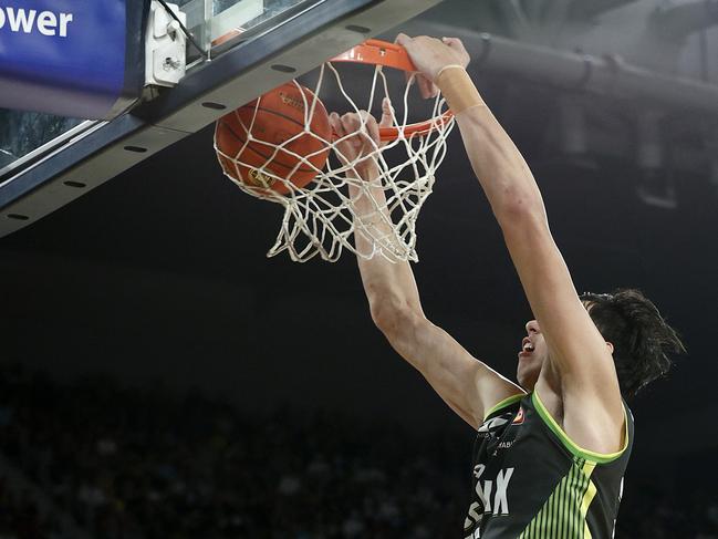 Zhou Qi with the big two-handed jam. Picture: Getty Images