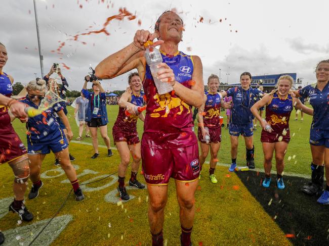 Emma Pittman of the Lions celebrates her first match with teammates after the Lions win during the AFLW round 4 match between the Brisbane Lions and the Fremantle Dockers at South Pine Sports Complex in Brisbane, Saturday, February 24, 2018. (AAP Image/Glenn Hunt)