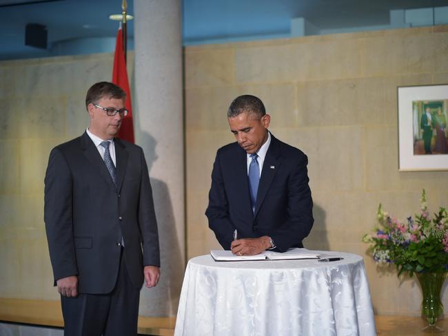 US President Barack Obama signs a condolence book at the Netherlands Embassy in Washington, DC. Picture: AFP