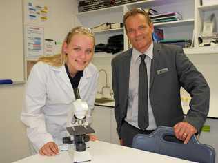 THROUGH THE LENSE: Mountain Creek State High school student Saara Silvola practising her skills with executive principal Darrin Edwards. Picture: Eden Boyd