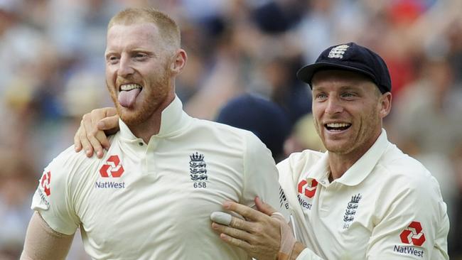 England's Ben Stokes, left, is congratulated by teammate Jos Buttler for dismissing India's Lokesh Rahul during the third day of the first test cricket match between England and India at Edgbaston in Birmingham, England, Friday, Aug. 3, 2018. (AP Photo/Rui Vieira)