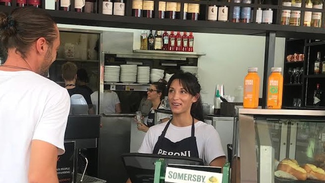 Cafe Spritz staff member Lili Fonroques serves a customer. The popular outlet is closing its doors at the end of the month after losing out in the tender. Photo: Glen Norris