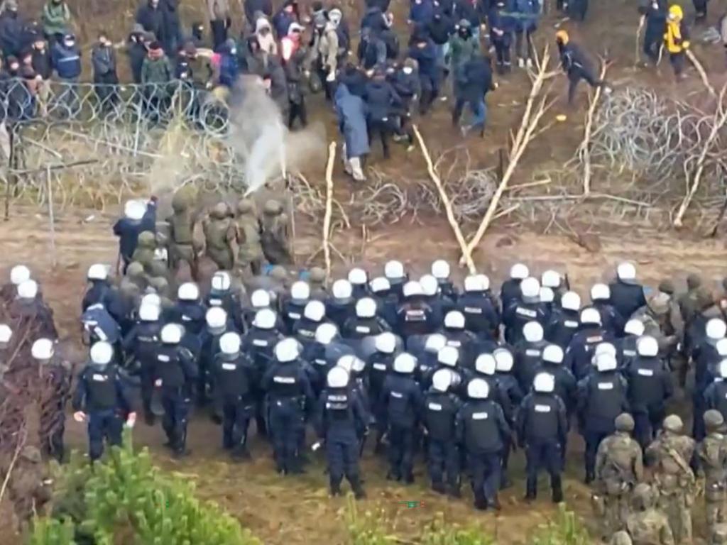 Migrants clashing with security personnel at the border. Picture: Polish Defence Ministry