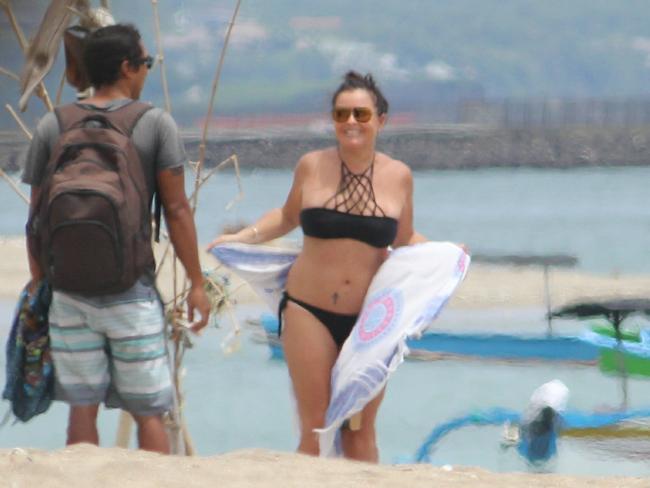 Schapelle Corby greets her boyfriend Ben after sunbathing on a Bali beach.