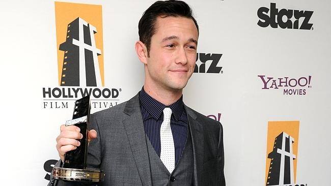 Joseph Gordon-Levitt poses backstage with the Hollywood breakthrough actor award at the 15th Annual Hollywood Film Awards Gala on Monday, Oct. 24, 2011 in Beverly Hills, Calif. (AP Photo/Kristian Dowling) 