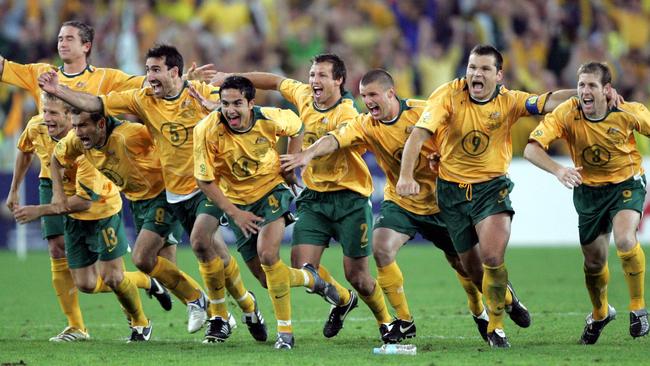 Socceroos players celebrate.