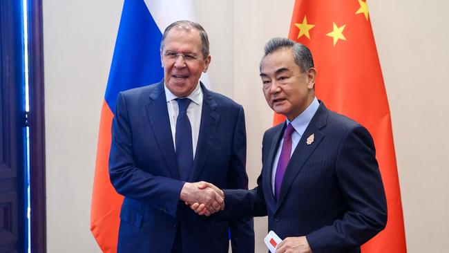 Chinese Foreign Minister Wang Yi met with his Russian counterpart Sergei Lavrov in Bali. Penny Wong is likely to call for China to use its influence over Russia to end the war in Ukraine. Picture: Russian Foreign Ministry / AFP