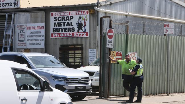 Police interview Denron Metals employees after the crash. Picture: Emma Brasier