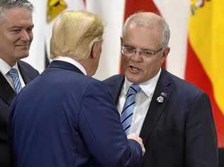 Australia's Prime Minister Scott Morrison, right, chats with U.S. President Donald Trump, centre. Picture: Kazuhiro Nogi