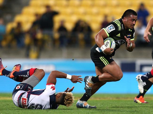 WELLINGTON, NEW ZEALAND - MAY 04: Asafo Aumua of the Hurricanes runs over Will Genia of the Rebels during the round 12 Super Rugby match between the Hurricanes and Rebels at Westpac Stadium on May 04, 2019 in Wellington, New Zealand. (Photo by Hagen Hopkins/Getty Images)