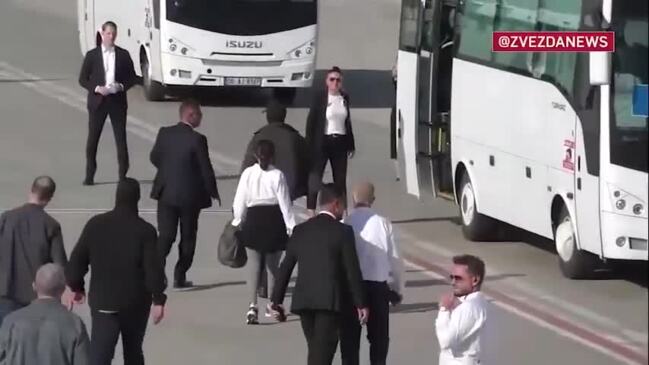 Newly Freed American, German, and Russian Prisoners Board Buses in Ankara During Swap