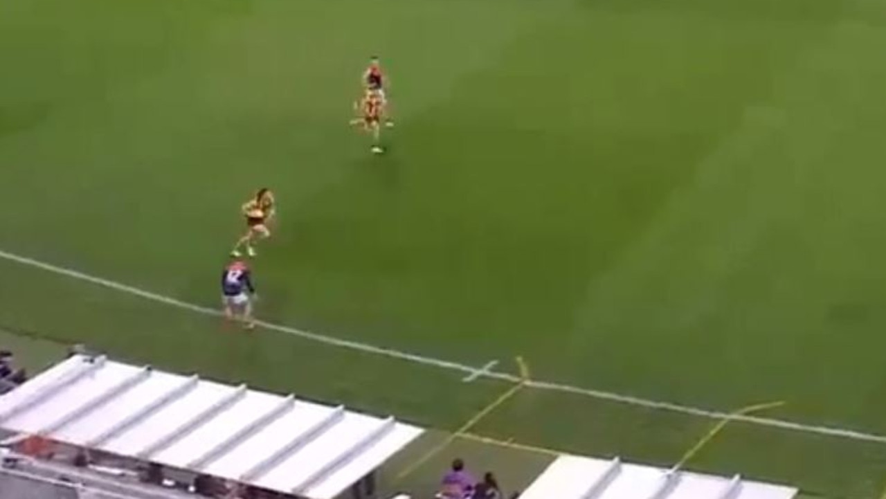 Melbourne wingman Lachie Hunter has been penalised after running towards the boundary line in an apparent attempt to put off a Hawthorn player while he was on the interchange bench.