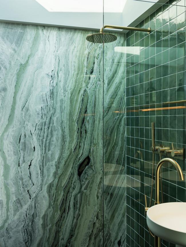 The stylish ensuite in the 'Sydney' apartment which features jade marble and a rainwater shower. Picture: ADAM GIBSON