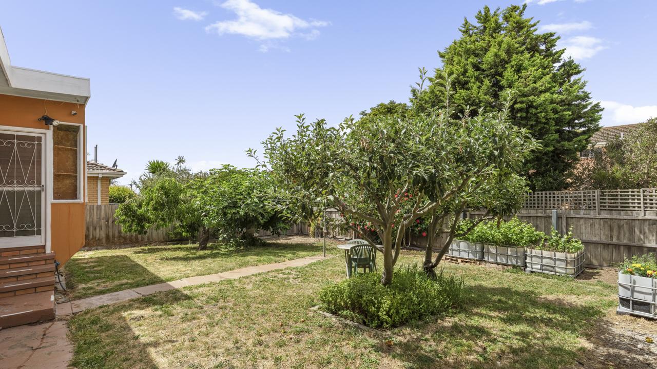 The back yard is a blank canvas, with space for creating an outdoor entertainment area.