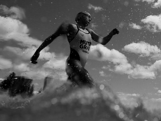 COOLANGATTA, AUSTRALIA - OCTOBER 13:  (EDITORS NOTE: Image has been converted to black and white.) Jemma Smith runs into the water during the 2019 Coolangatta Gold on October 13, 2019 in Coolangatta, Australia. (Photo by Chris Hyde/Getty Images)