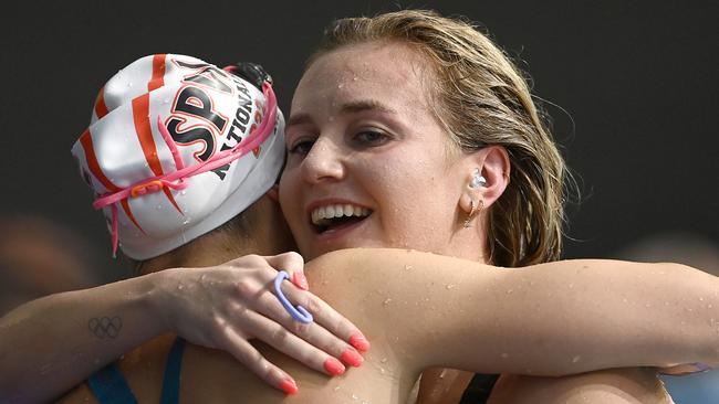 Titmus is congratulated by Jamie Perkins after breaking the world record. Picture: Quinn Rooney/Getty Images