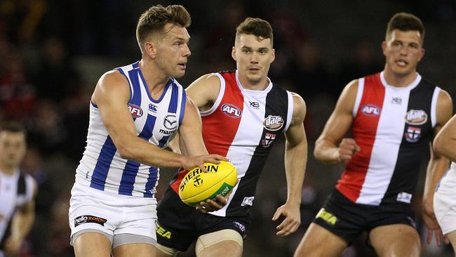 Shaun Higgins puts North Melbourne on the attack.