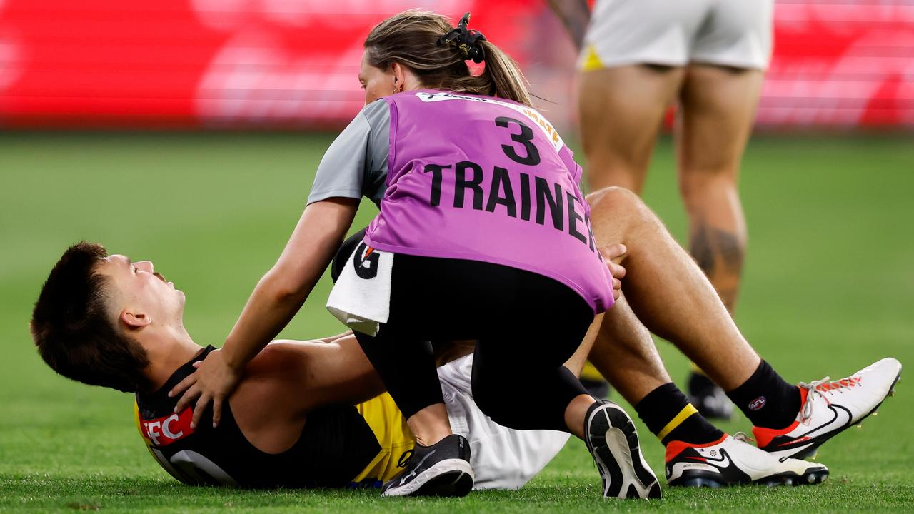 Richmond’s Josh Gibcus landed awkwardly and suffered a serious knee injury. (Photo by Dylan Burns/AFL Photos via Getty Images)