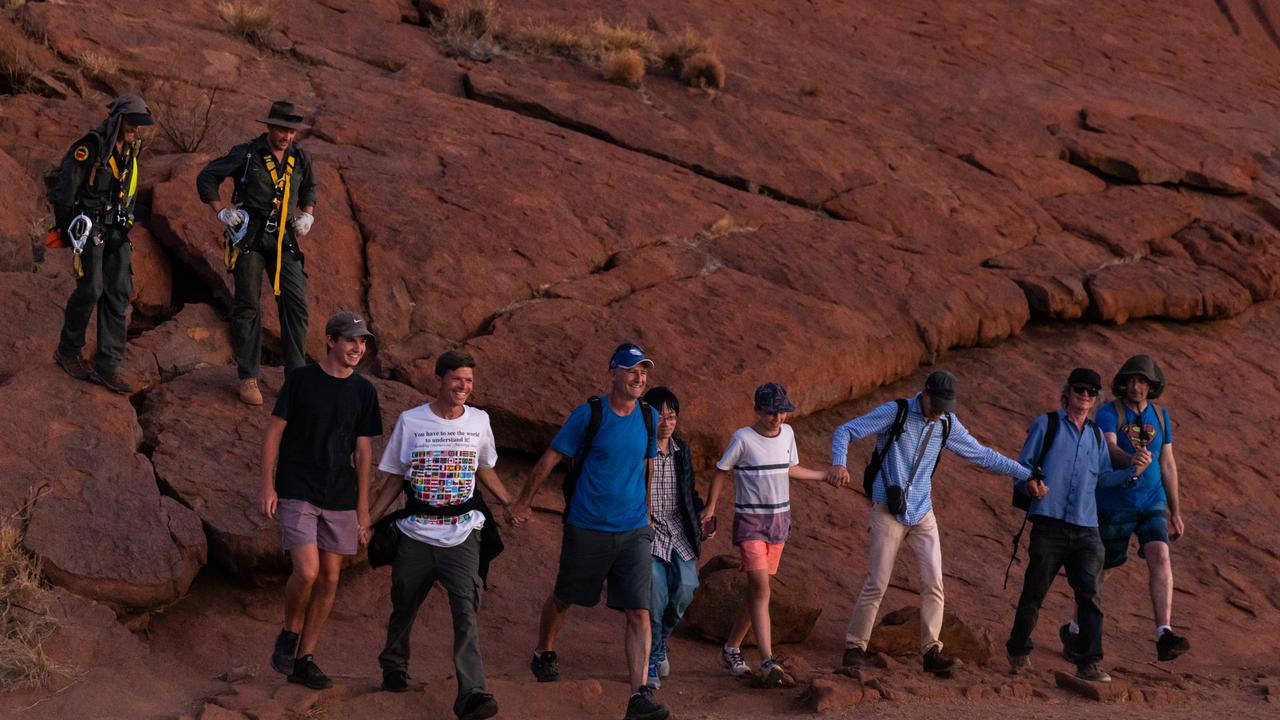 The two rangers and the group of eight who finished the climb together. Picture: Emma Murray