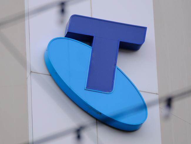 MELBOURNE, AUSTRALIA - NewsWire Photos OCTOBER 4, 2022. Generic photo people walking past the Telstra logo in Melbourne..Picture: NCA NewsWire / Luis Enrique Ascui