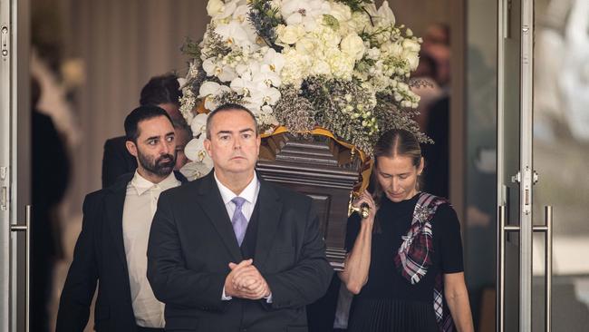 Andy Allen and Jock Zonfrillo’s wife Lauren carrying the chef’s casket after the funeral. Picture: Julian And