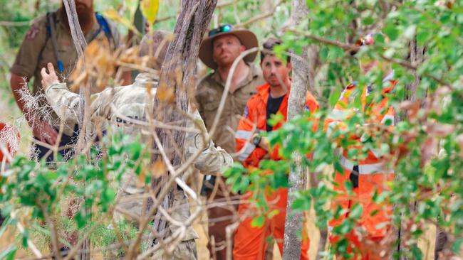 NTFES searchers debrief when after two nights lost in Litchfield National Park south of Darwin, missing Hiker Maggie was found. Picture: Glenn Campbell