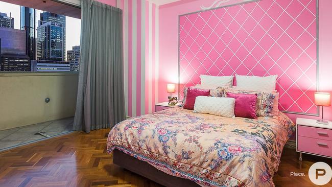 Georgia Fairweather’s plush pink bedroom is one of the three in the penthouse apartment at 906/229 Queen St, Brisbane which also has three bathrooms and three car parks. Picture: Place