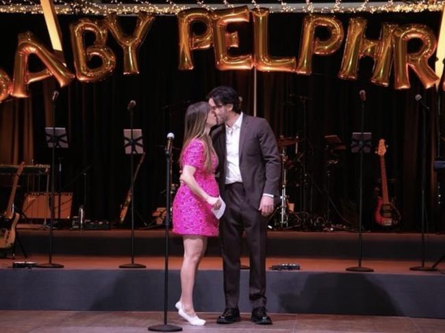 The couple onstage at their lavish shower.